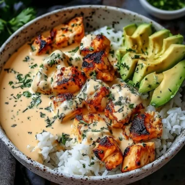 Coconut Chicken Rice Bowl served with fresh herbs and tropical ingredients