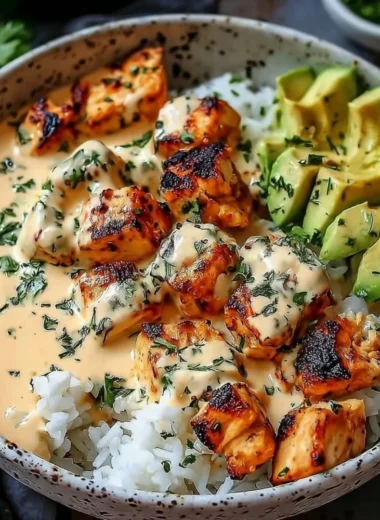 Coconut Chicken Rice Bowl served with fresh herbs and tropical ingredients