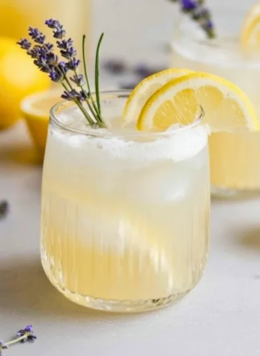 Coconut Lavender Lemonade Mocktail in a glass with lavender garnish