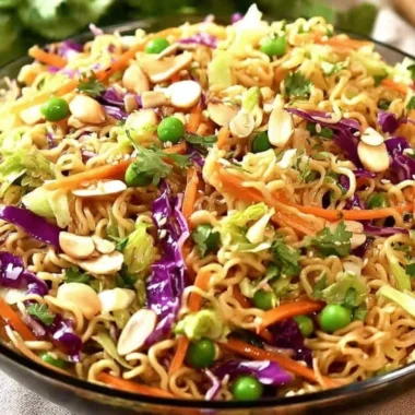 Bowl of crunchy Asian ramen noodle salad with vegetables and dressing