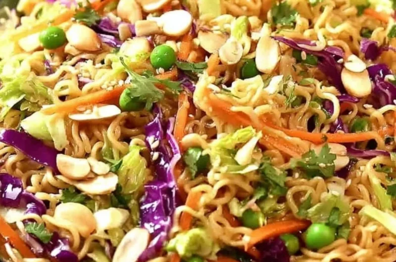 Bowl of crunchy Asian ramen noodle salad with vegetables and dressing