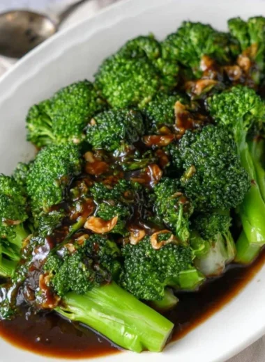 Plate of easy and delicious broccoli with garlic sauce cooked to perfection