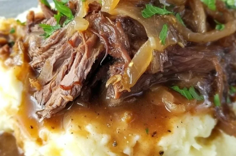 Delicious French Onion Pot Roast served with melted cheese and caramelized onions
