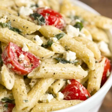 Delicious Greek Pasta Salad with olives, feta, tomatoes, and cucumbers.