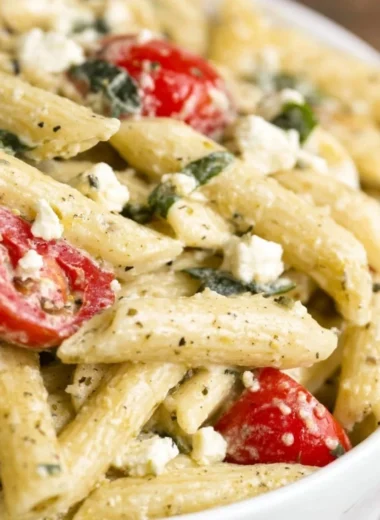 Delicious Greek Pasta Salad with olives, feta, tomatoes, and cucumbers.