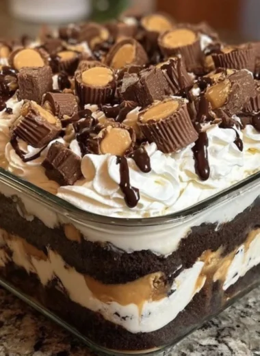 No-bake chocolate peanut butter mousse dessert topped with chocolate shavings.