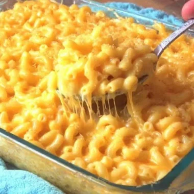 Delicious homemade macaroni and cheese in a creamy sauce topped with breadcrumbs.