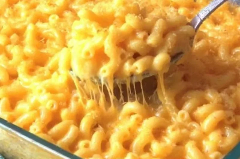 Delicious homemade macaroni and cheese in a creamy sauce topped with breadcrumbs.