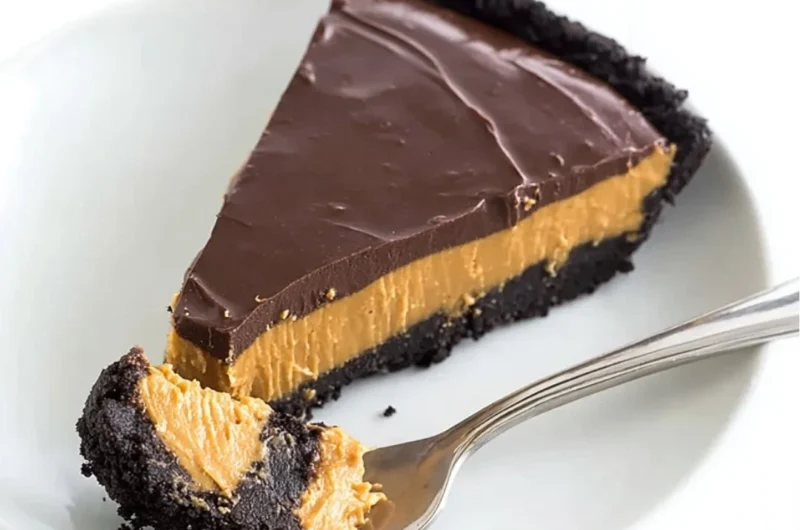 No bake chocolate peanut butter pie sliced and served on a plate